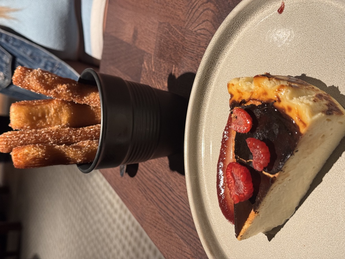 Churros and Basque cheesecake plated dessert