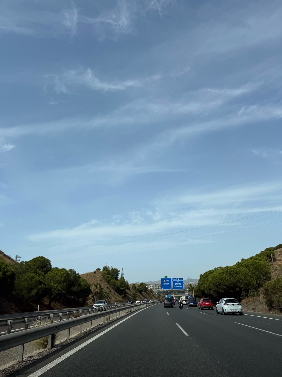 Overhead signs on the motorway showing the AP-7 toward Marbella and Algeciras alongside the A-7 toward Fuengirola