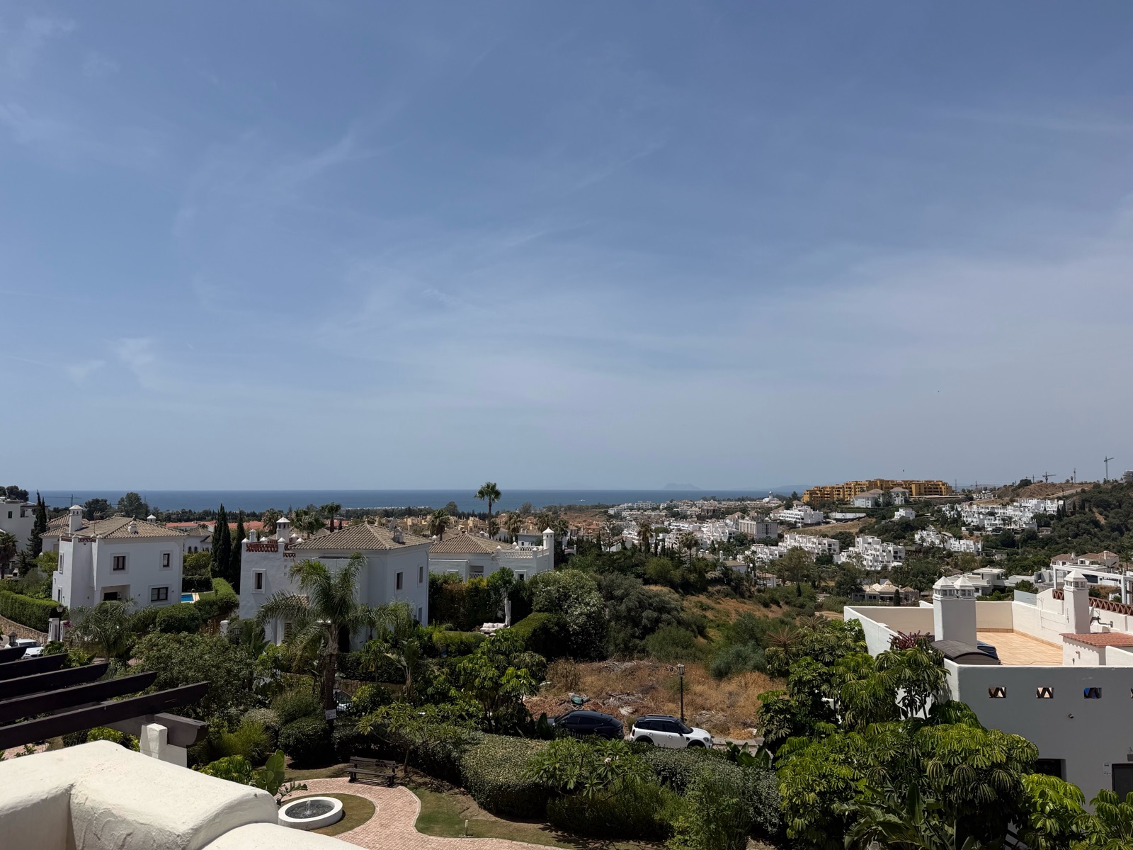 The white villas of the urbanization, the coast beyond