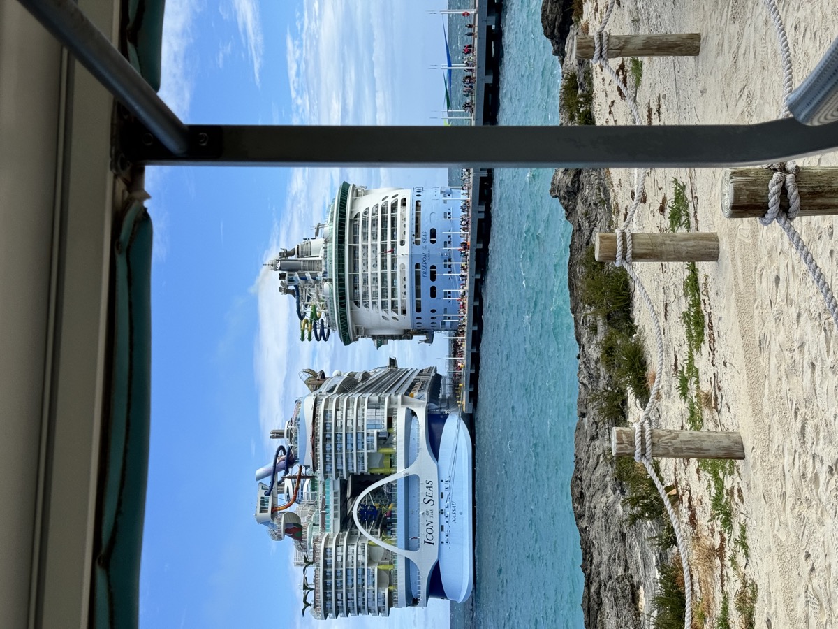 Icon of the Seas and Freedom of the Seas docked side-by-side at the CocoCay pier