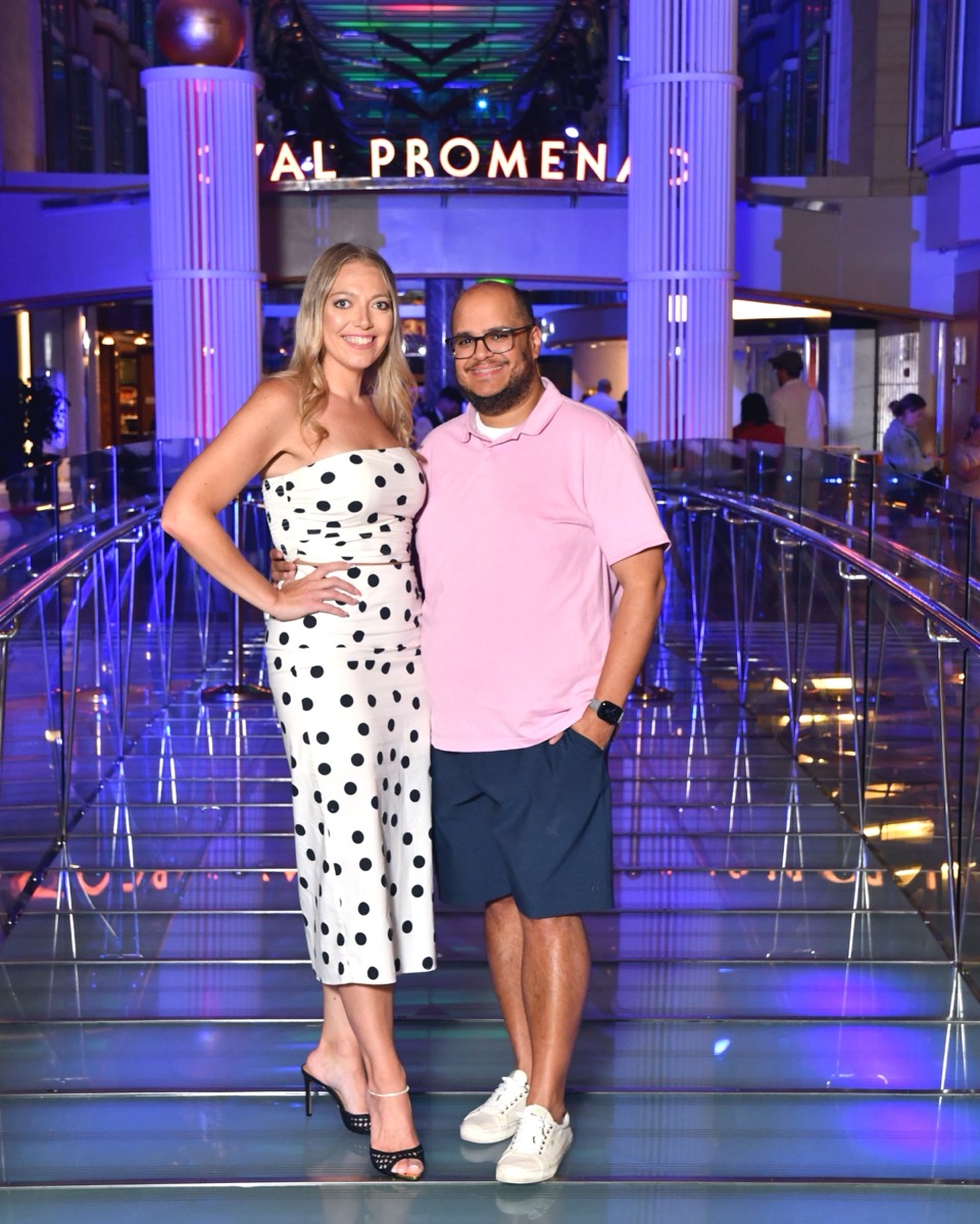 Ashley and Miguel posing on the Royal Promenade onboard Freedom of the Seas