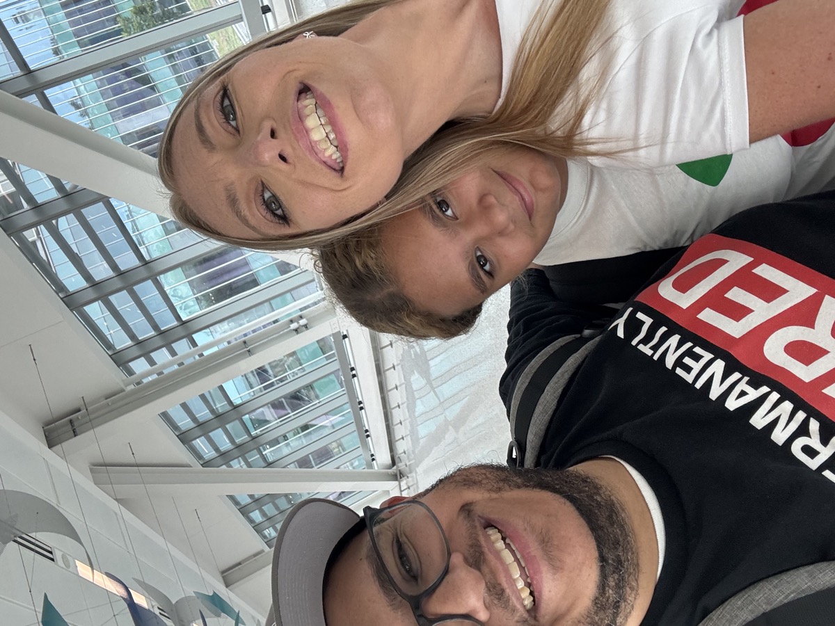 Family selfie at an airport terminal