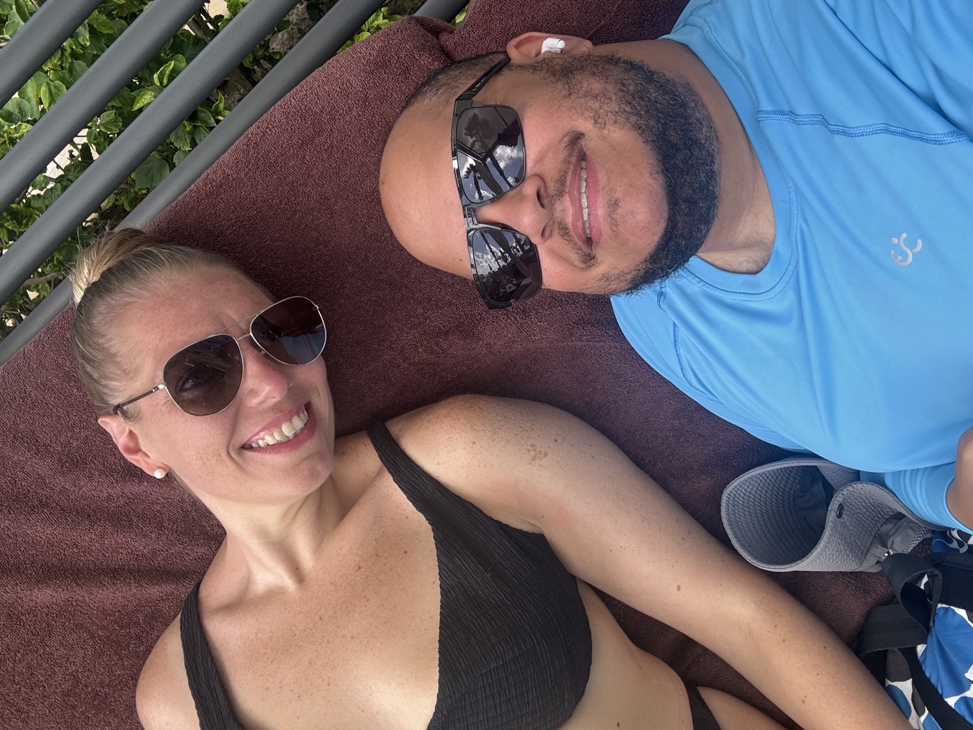 Ashley and Miguel sharing a sun bed at Secrets Riviera Cancun