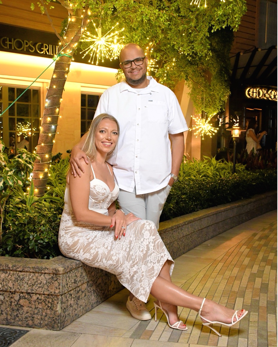 Couple at Chops Grille on formal night with sparklers in the background