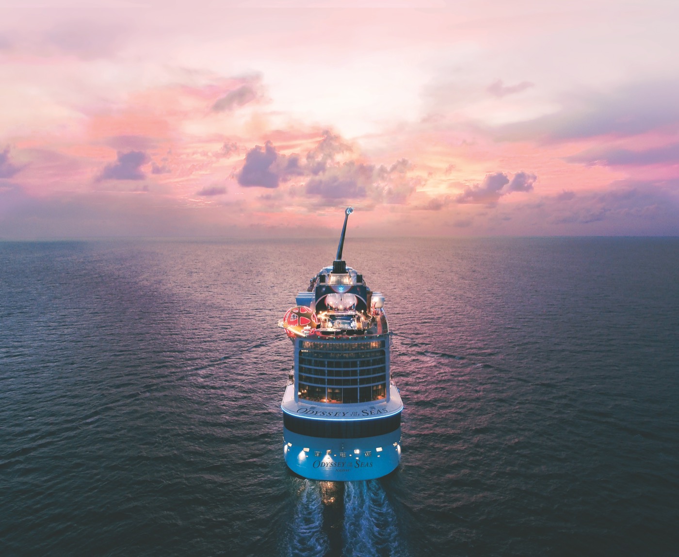 Odyssey of the Seas at sea, sunset behind the stern