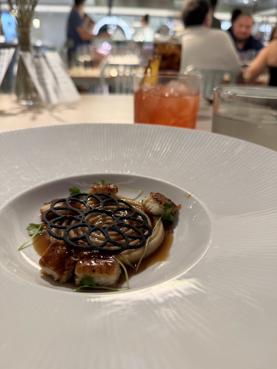 Plated specialty meal at The Test Kitchen