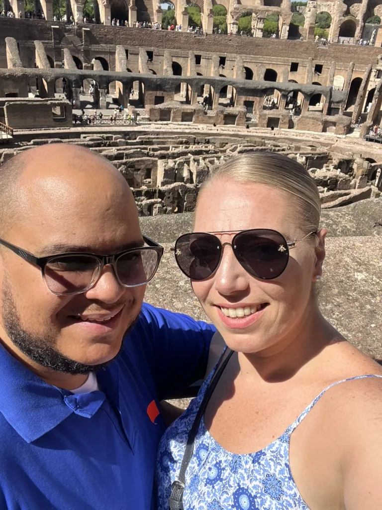 Miguel and Ashley taking a selfie inside the Colosseum